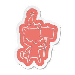 cute cartoon  sticker of a cat with sign wearing santa hat