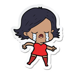 sticker of a cartoon girl crying and pointing