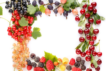 Frame of berries. Black, red and white currant, cherry, gooseberry, blackberry, strawberry, raspberry on white.  Food fruit summer concept. Top view, flat lay, close-up.