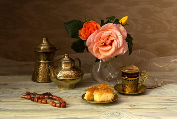 Obraz na płótnie Canvas Still life with roses and coffee service