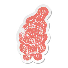 cartoon distressed sticker of a angry old woman wearing santa hat