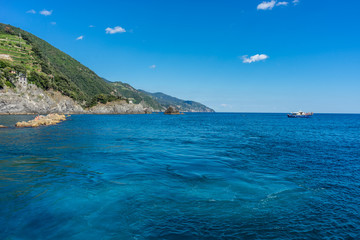 Fototapeta na wymiar Italy, Cinque Terre, Monterosso, an island in the middle of a body of water