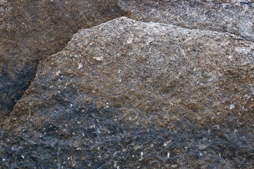 Close up texture of granite walls and rocks in high resolution with cracks and stunning structures