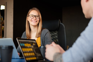 Man and woman work in a modern office. Project Discussion.