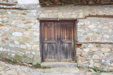 Stone house wall of old house in Olympic riviera, Greece