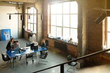 Man and woman work in a modern office. Project Discussion.