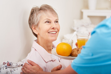 Senior woman with healthy breakfast