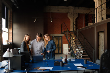 The team is working on a project in a modern office.