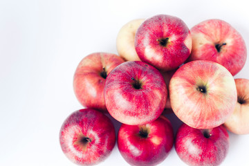 Fresh ripe red apples on white background, vegetarian concept.
