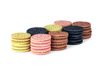 Fototapeta na wymiar colored round biscuits in a slolbik on a white background