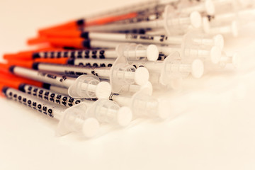 Pile of medical syringes for insulin for diabetes .