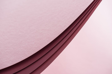 blank and bright sheets of paper on pink background with copy space