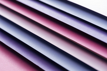 Obraz premium empty blue, white, pink and purple sheets of paper on pink background
