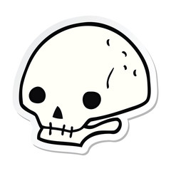 sticker of a cartoon spooky skull