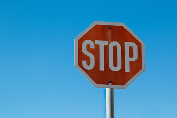 Stop traffic sign and a blue sky