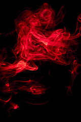 Fototapeta premium Red smoke on black background