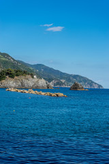 Obraz premium Italy, Cinque Terre, Monterosso, a large body of water with a mountain in the background