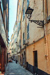 Impression of the narrow street Via Camillo Benso di Cavour in the center of the Italian town San Remo