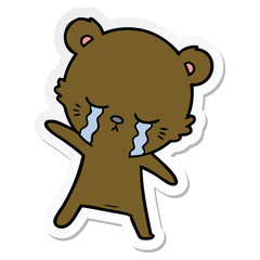sticker of a crying cartoon bear