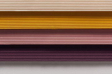 Obraz premium top view of white, yellow, pink, purple papers on white background with copy space