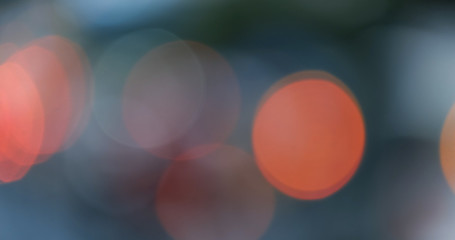 Defocused, blurred bokeh and abstract blurry of red taillights moving on night street. Royalty high-quality free stock photo image of colorful red light in night, glowing backdrop overlay for design