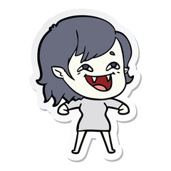sticker of a cartoon laughing vampire girl