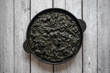 Black chili beans in a frying pan. Top view.