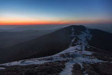Fototapeta na wymiar Morning gradient shades on the Carpathian mountains.Twilight in the Carpathian Mountains. Blazing sky and blue mountain ranges