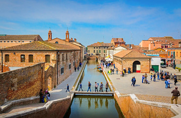 Beautiful colorful houses and water channels in Comacchio town in Emilia-Romagna region