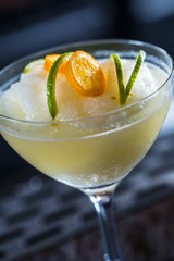 Cocktail drink frozen margarita at barcounter in night club or restaurant