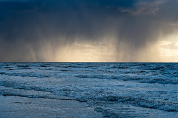 Stormy clouds above Baltic sea in winter time, Latvia coast.