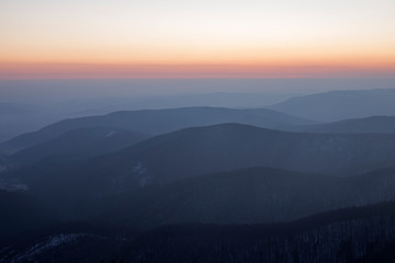 Morning gradient shades on the Carpathian mountains.Twilight in the Carpathian Mountains. Blazing sky and blue mountain ranges