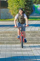 Boy playing with bicycle