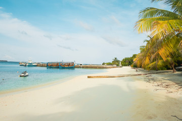 Amazing island in the Maldives , turquoise waters with  blue sky  background for holiday vacation .