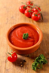 tomato sauce on wood background