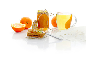 The orange jam on rusks and tea