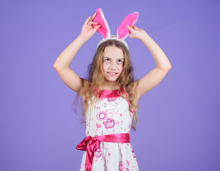 Obraz na płótnie Canvas Having such a long ears. Easter bunny concept. Little girl wearing bunny ears. Small girl in bunny headband for Easter celebration. Easter bunny is symbol of Easter