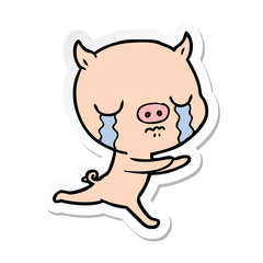 sticker of a cartoon pig crying