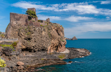 Fototapeta na wymiar Beautiful view of Aci Castello overlooking the sea on a beautiful sunny day, Catania, Sicily, Italy