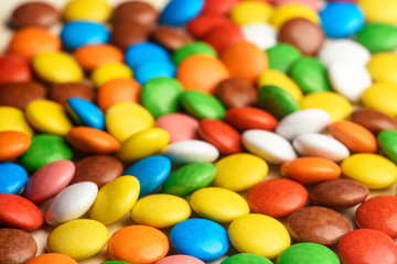 colored round candy scattered on the table close-up