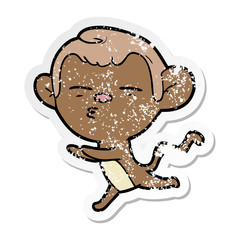distressed sticker of a cartoon suspicious monkey
