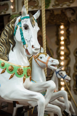 Fototapeta na wymiar Horses on the merry-go-round.