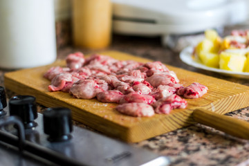 Fresh raw meat on wooden cutting board