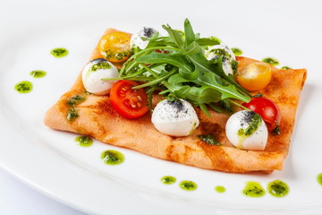 Pancake with tomato and Arugula