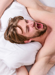 Fototapeta na wymiar Get adequate and consistent amount of sleep every night. Expert tips on sleeping better. How much sleep you actually need. Bearded man sleeping face relaxing on pillow. Man handsome guy lay in bed