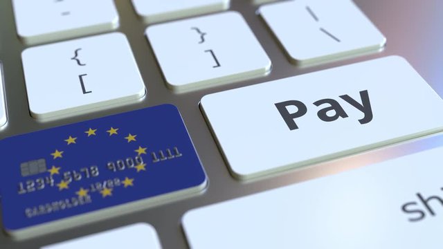 Bank card featuring flag of the European Union as a key on a computer keyboard. EU online payment conceptual animation - Powered by Adobe
