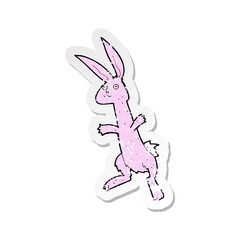 retro distressed sticker of a cartoon rabbit