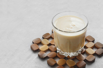 cup of coffee with cream on white background