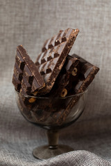 Chopped chocolate on rustic sackcloth