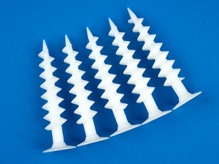 Special dowels for fixing light objects in styrofoam insulation, on blue background